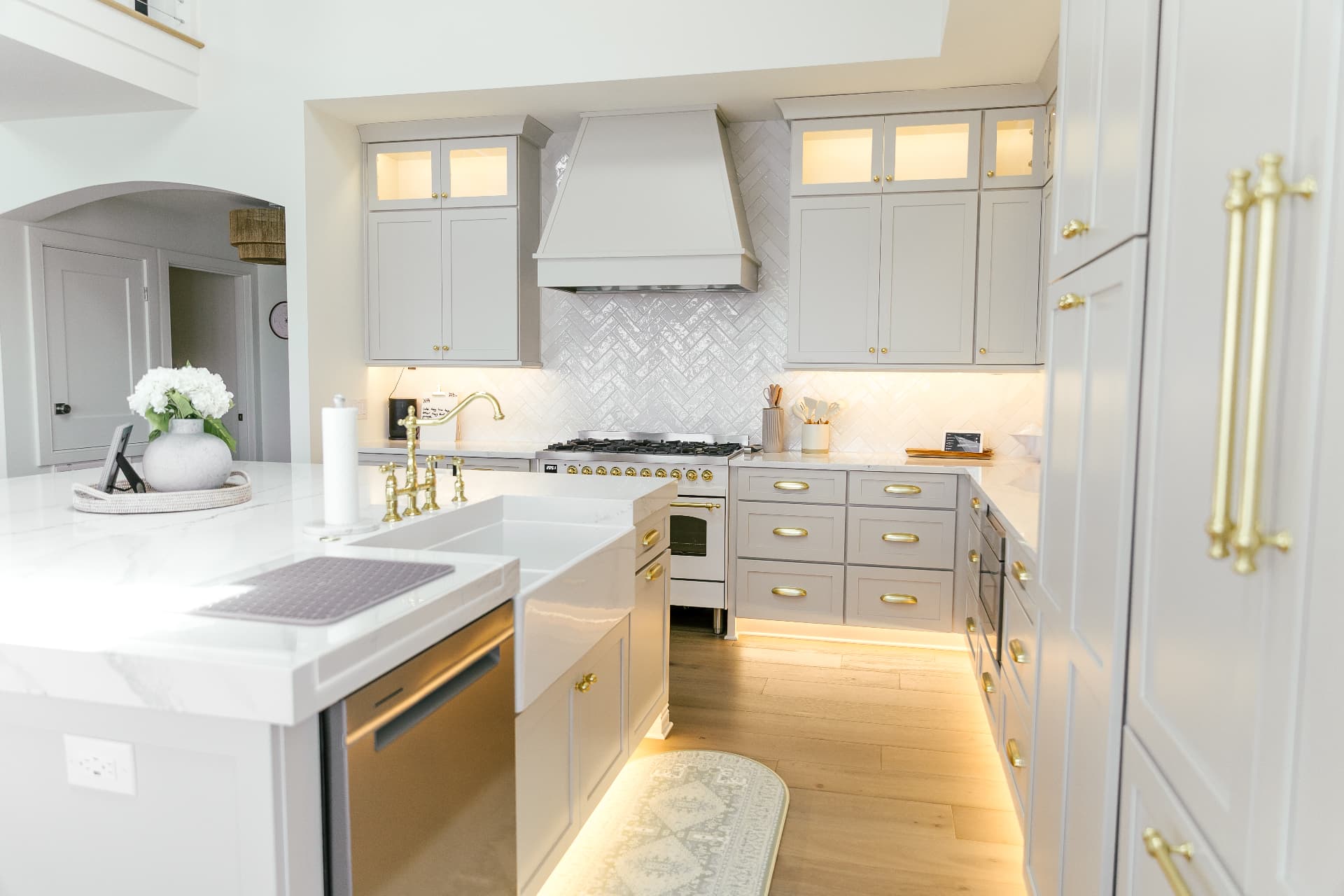 A renovated coastal kitchen with brass fixtures
